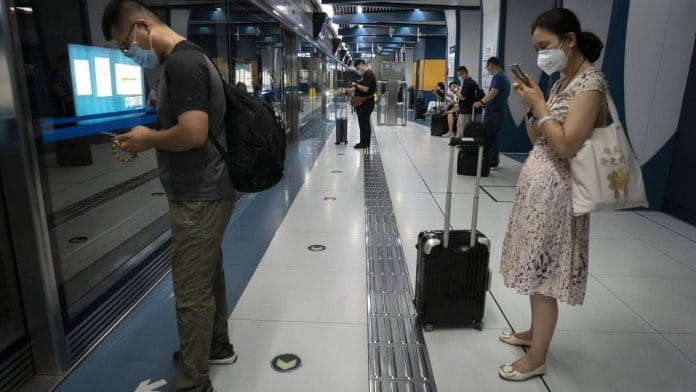 Representational Image | File photo of travelers waiting for the airport shuttle at Sanyuanqiao Subway Station in Beijing | Photographer: Giulia Marchi | Bloomberg