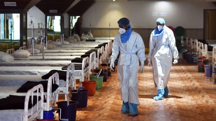 Healthcare workers wearing PPE kits seen in a temporarily converted isolation ward for the Covid infected patients in New Delhi, on 14 January 2022 | Representational image | ANI photo