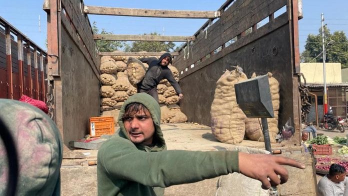 Potato farmers unload their wares at Surya Nagar mandi, Mathura | Photo: Unnati Sharma | ThePrint