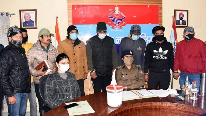 Uttarakhand Police STF officials with the four arrested men in Udham Singh Nagar Friday | ANI