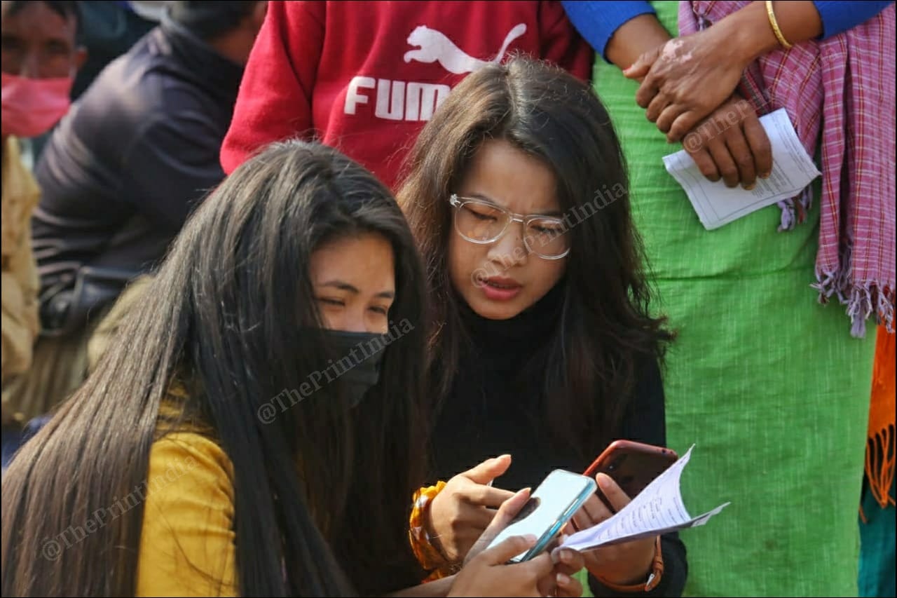 Girls sitting outside a polling booth at Takhel primary school in Lamlai constituency | Praveen Jain | ThePrint