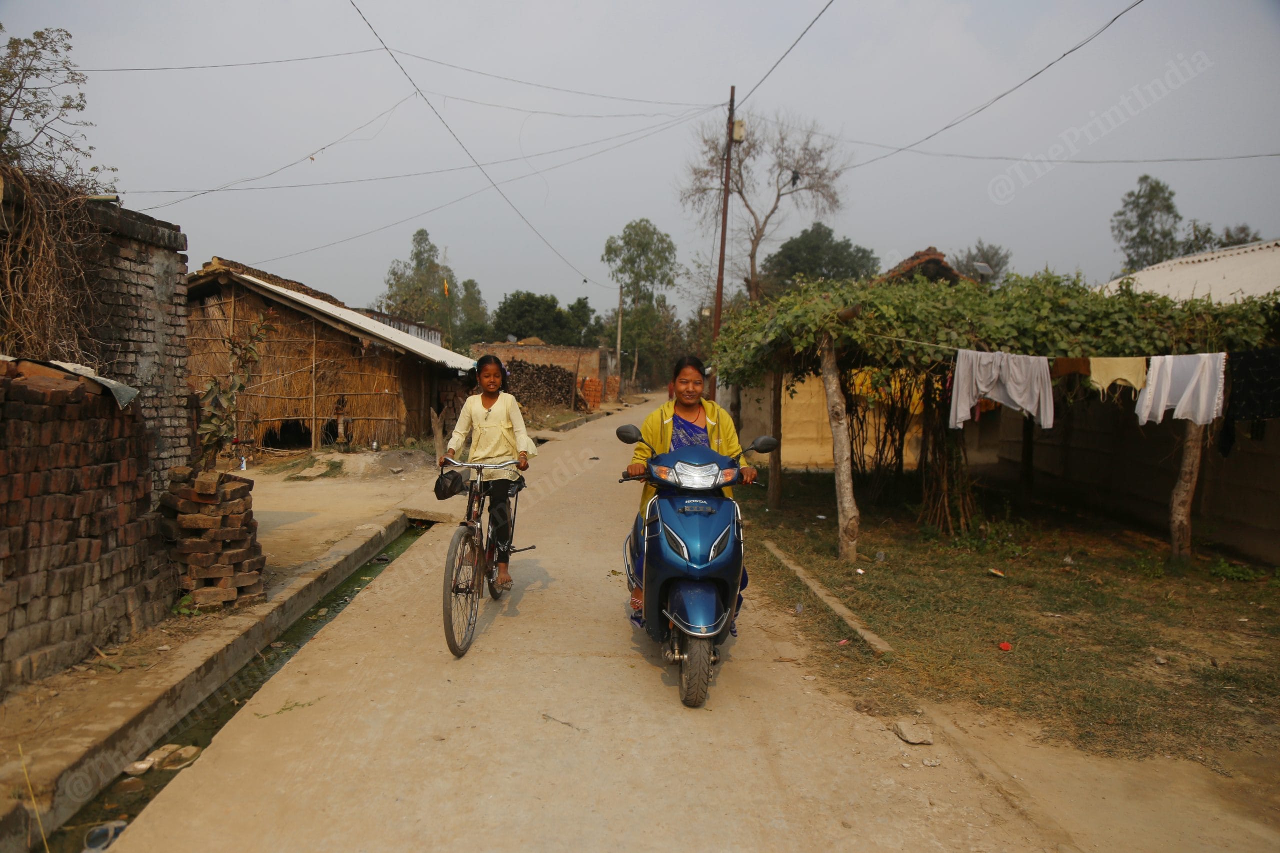 Gayatri Devi of Motipur village is one of the first women in the village who knows to ride a scooty, she drops her childdren to school | Photo: Mnaisha Mondal | ThePrint