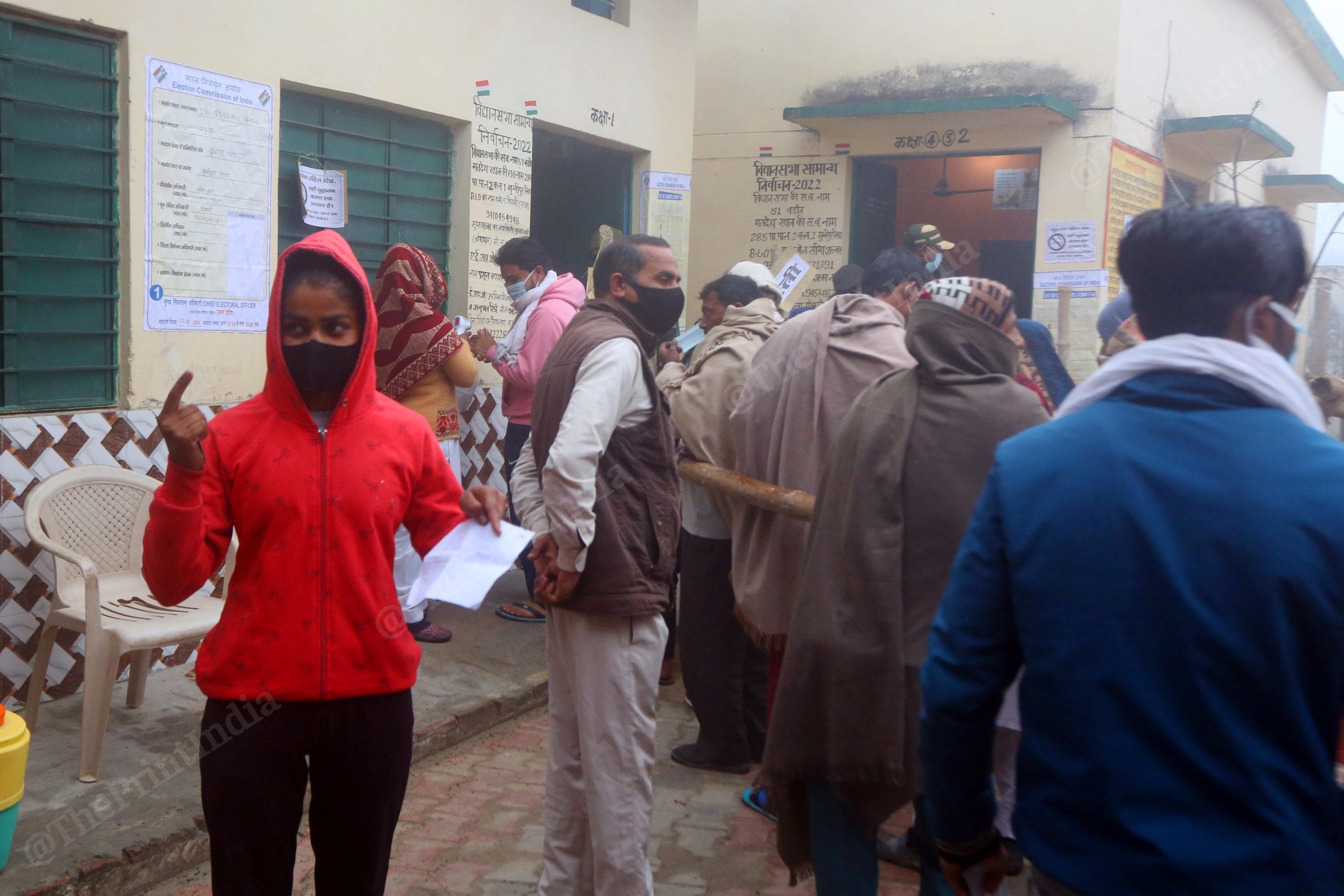 A young, first time voter, shows off her inked finger after casting her vote for the 2022 UP assembly elections | Praveen Jain | ThePrint