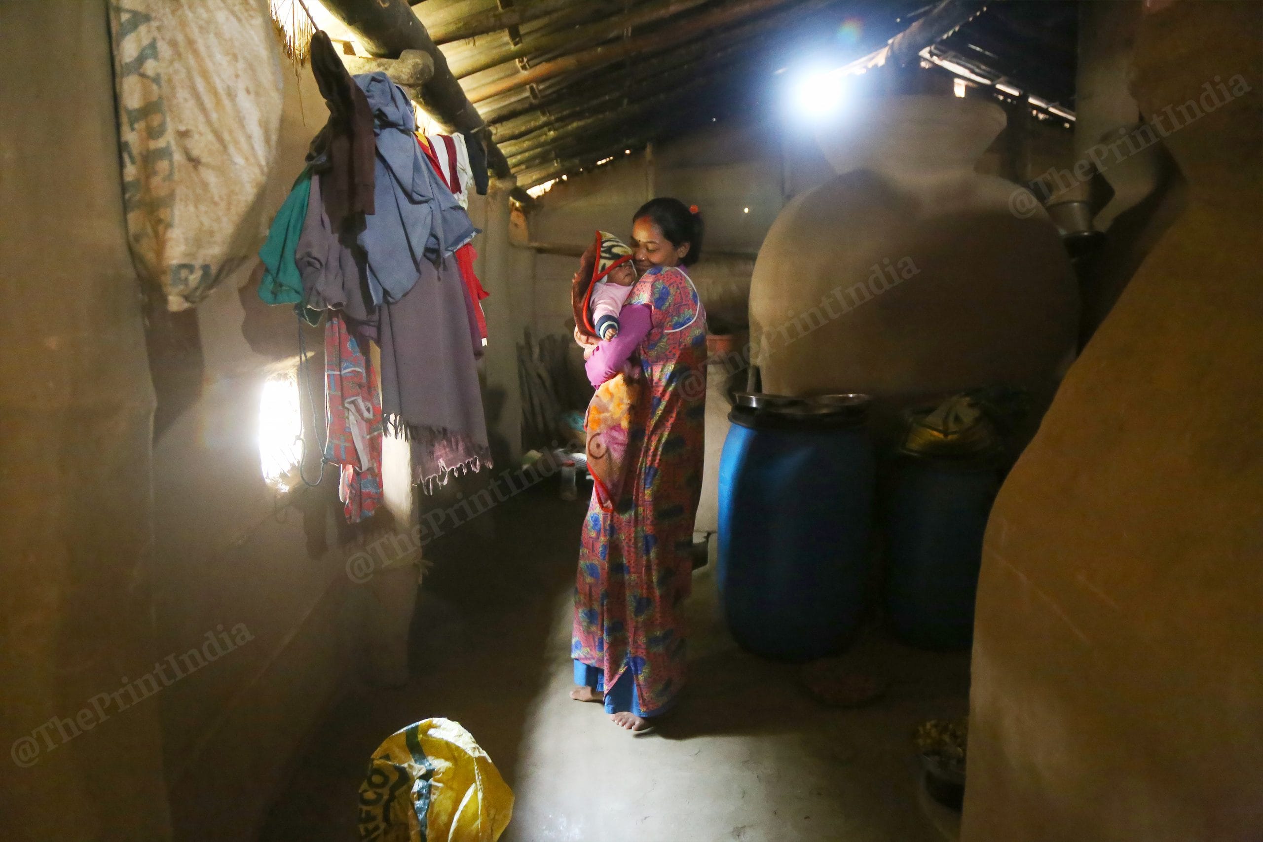 The houses in the Tharu village have big cylindrical storage called "Dheri", they are used to keep grains | Photo: Manisha Mondal | ThePrint