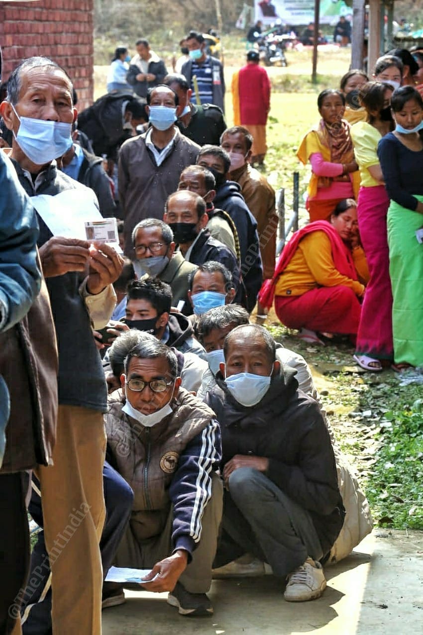 Voters sitting in a queue to cast their vote at polling booth at Lamlai, Manipur | Praveen Jain | ThePrint