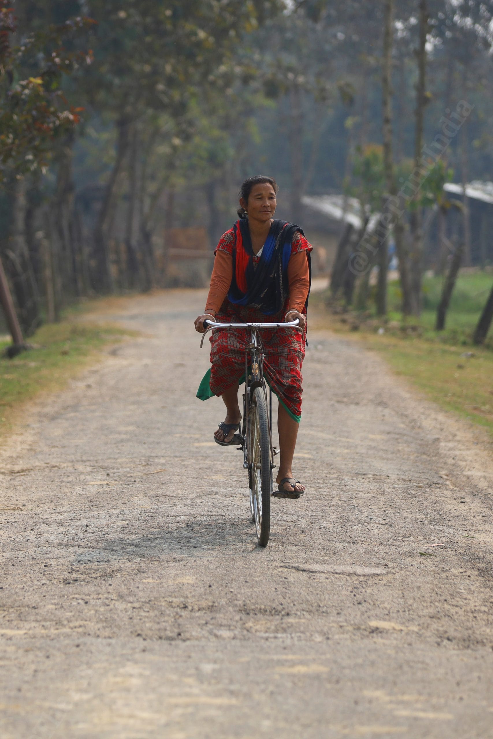 A woman rides bicycle on the streets on village | Photo: Manisha Mondal | ThePrint