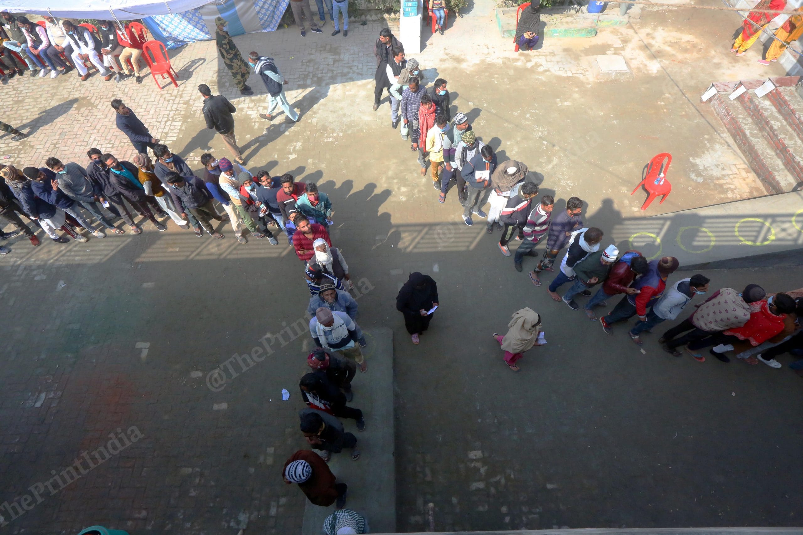Voters stand in queue at a polling station in Kairana | Praveen Jain | ThePrint