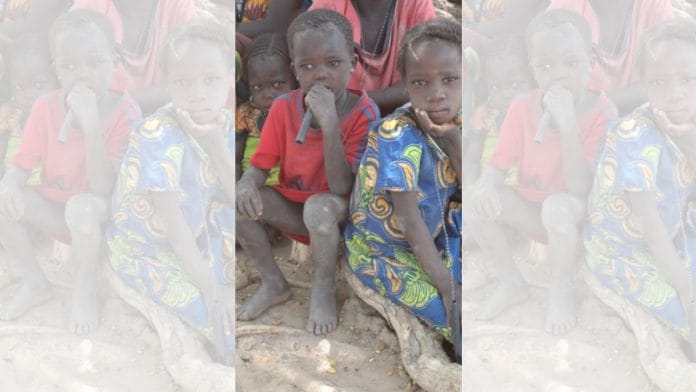 Children in Chad hold pipe filters used to prevent the transmission of Guinea-worm disease | Commons