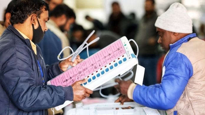 Polling officials check the EVMs and VVPAT machines for second phase of Uttar Pradesh Assembly elections, at Ramabai Ambedkar Rally Ground, in Lucknow on 12 February 2022 | Photo: ANI