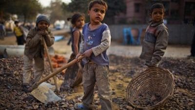 Indian children work at a construction project in New Delhi, India | Daniel Berehulak/Getty Images
