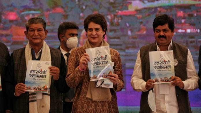 AICC general secretary Priyanka Gandhi Vadra releasing the manifesto with former Uttarakhand CM Harish Rawat (left) and state Congress chief Ganesh Godiyal in Dehradun on 2 February. | Suraj Singh Bisht | ThePrint