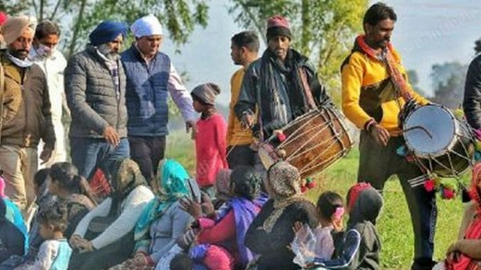 Congress cabinet minister Pargat Singh (in blue turban) campaigning at Jandiala village in Jalandhar Cantonment | Praveen Jain | ThePrint