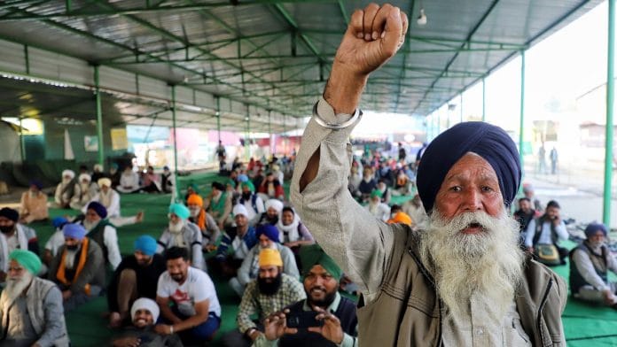 File photo of a farmer raising slogans after the anti-farm law protests were called off in December last year, at the Singhu border in New Delhi | ANI