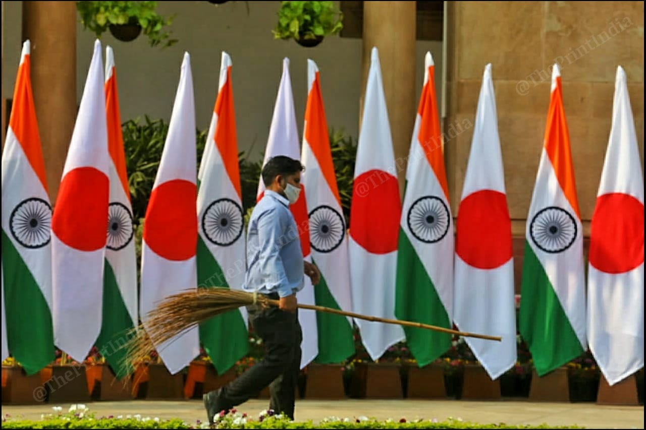 A sanitation worker cleans the grounds before the arrival of the two leaders | Photo: Praveen Jain | ThePrint
