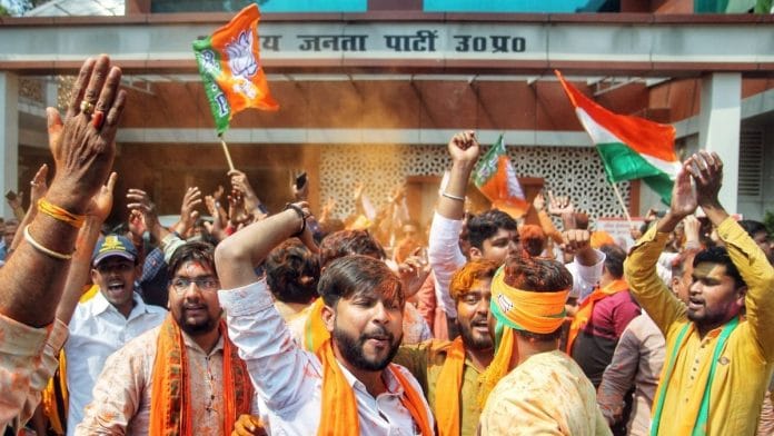 BJP supporters celebrate as the party leads in Uttar Pradesh Assembly elections, at state party office, in Lucknow on 10 March 2022 | ANI photo