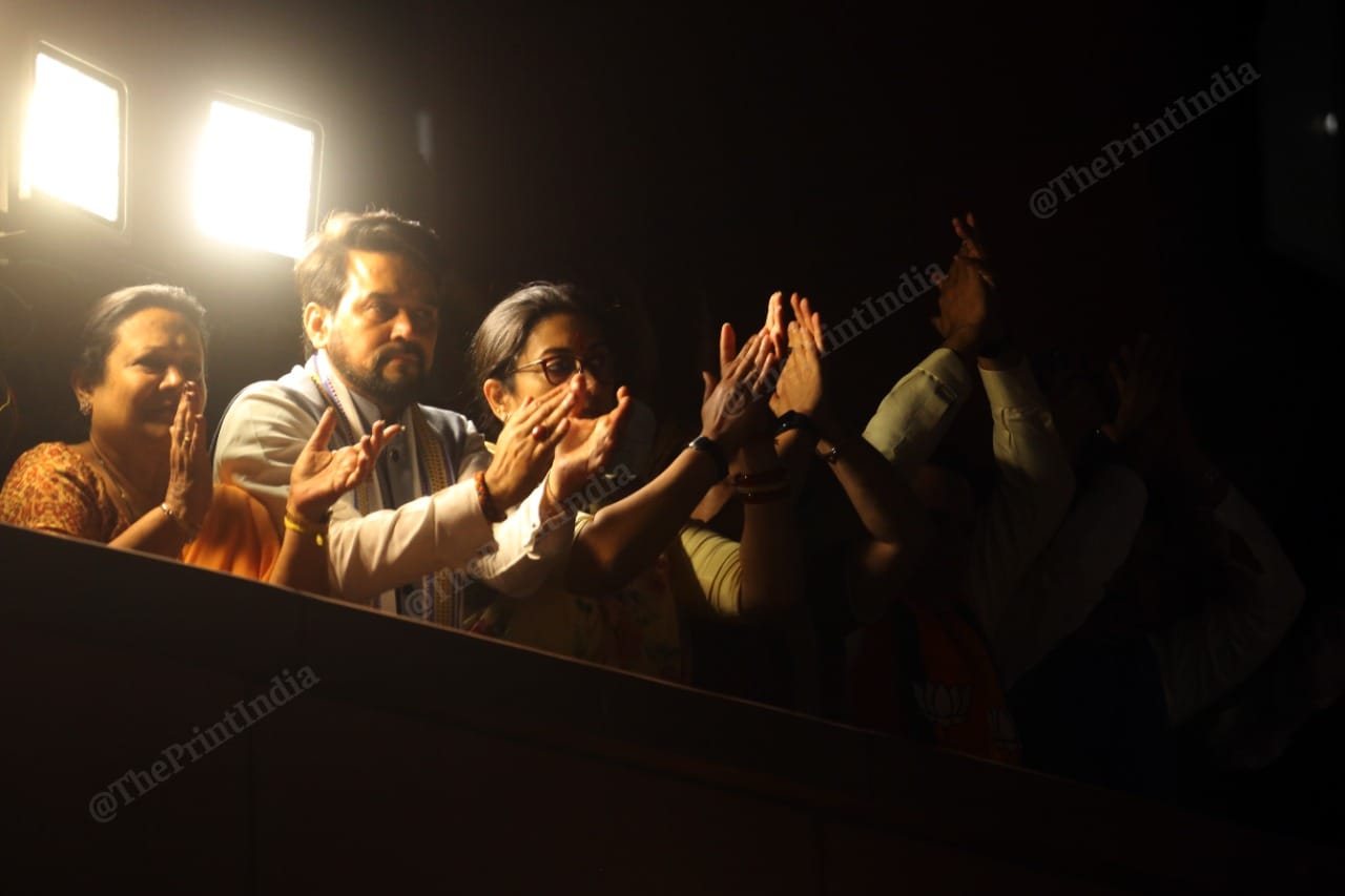 Union ministers Anurag Thakur and Smriti Irani cheer as Modi addresses party workers | Photo: Praveen Jain | ThePrint