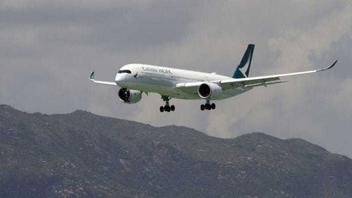 An Airbus SE A350 aircraft operated by Cathay Pacific Airways Ltd. prepares to land at Hong Kong International Airport in Hong Kong, China| Representational image| Photographer: Vivek Prakash/Bloomberg