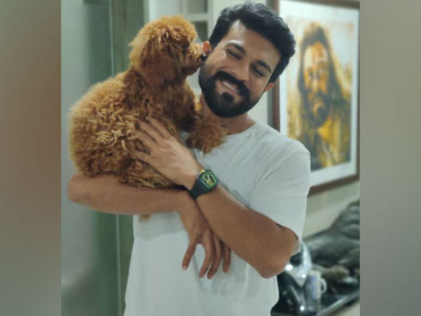 Pet parent Ram Charan returns home to Rhyme amid 'RRR' promotions