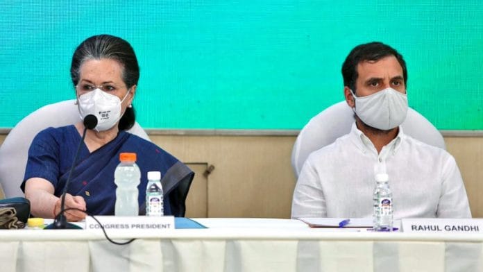 Congress interim president Sonia Gandhi with party leader Rahul Gandhi during the Congress Working Committee meeting, at the party headquarters, in New Delhi Sunday. | Photo: ANI