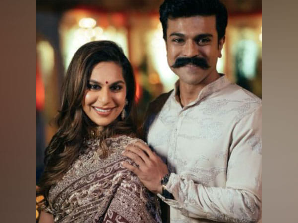 Ram Charan's wife Upasana happily throws confetti at a theatre screen while watching 'RRR' 