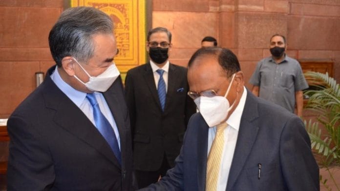National Security Advisor Ajit Doval with visiting Chinese Foreign Minister Wang Yi at the South Block, in New Delhi on 25 March. | Photo: ANI