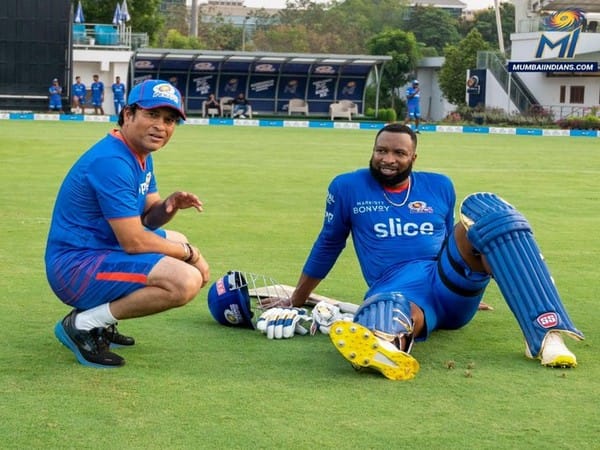 Sachin Tendulkar congratulates Kieron Pollard on his retirement from international cricket