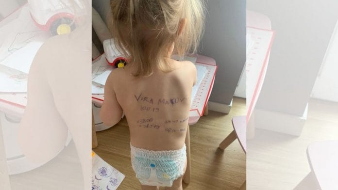 Ukrainian mothers write their family contacts on bodies of their children | Instagram/aleksandra.mako