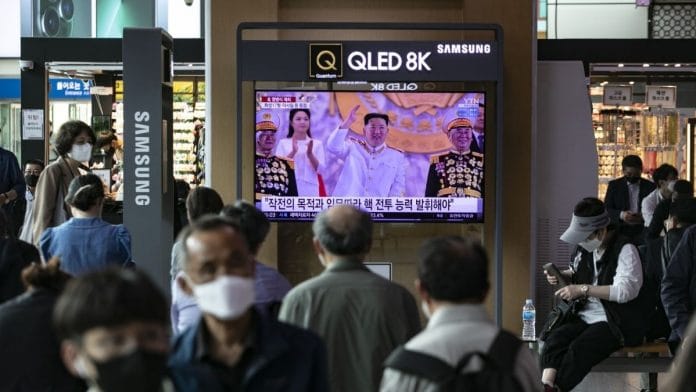 A news broadcast of North Korea on a TV screen at Seoul Station | Bloomberg