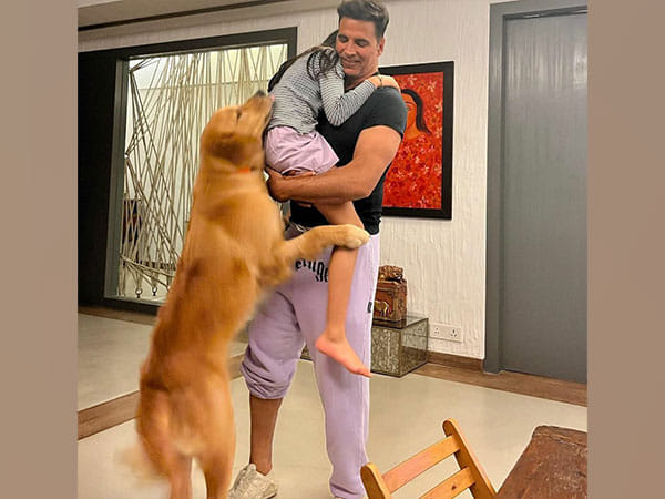 Akshay Kumar adorably hugs his daughter, pet dog in this picture 