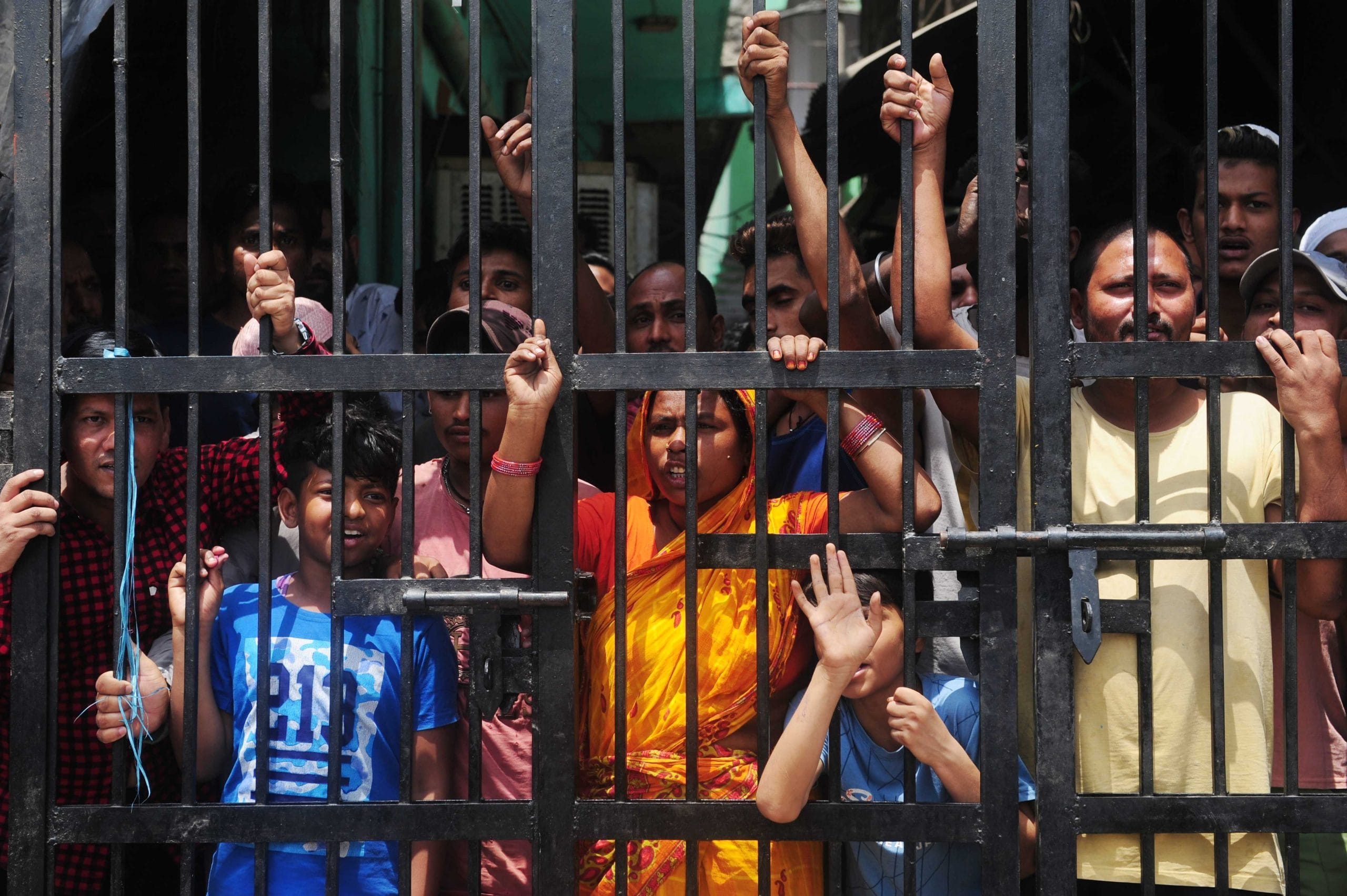 Local residents penned in by gates protest during the demolition drive at Jahangirpuri on 20 April | Photo: Suraj Singh Bisht | ThePrint