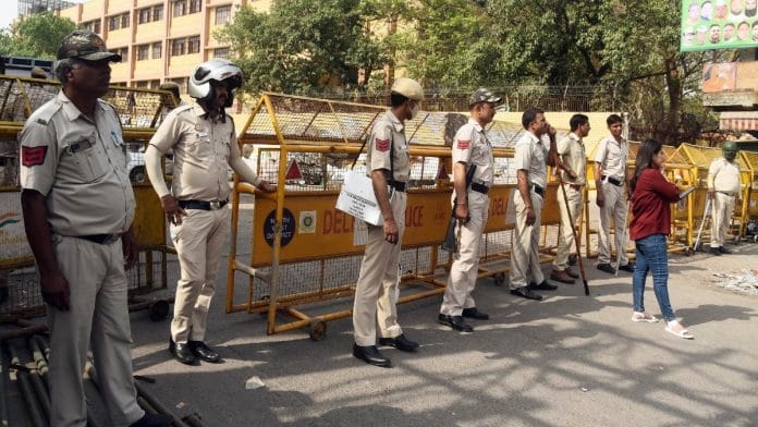 Police personnel stand guard at Jahangirpuri's C Block, in New Delhi Monday | ANI
