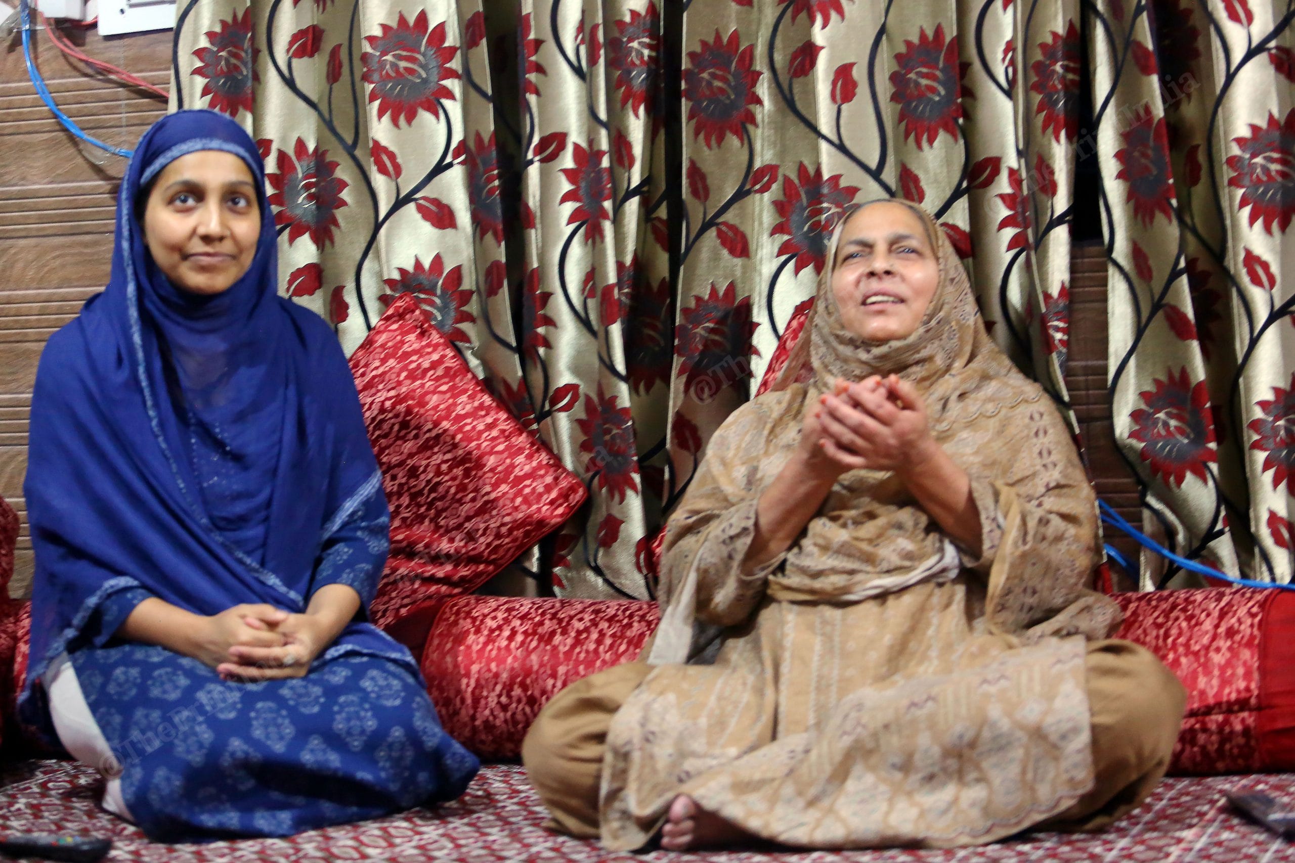 Seema Begam ( Mother) and Shehnaz ( Sister) of Umran Malik praying for his son for wicket while watching an IPL match between SRH vs CSK at his home | Photo: Praveen Jain | ThePrint