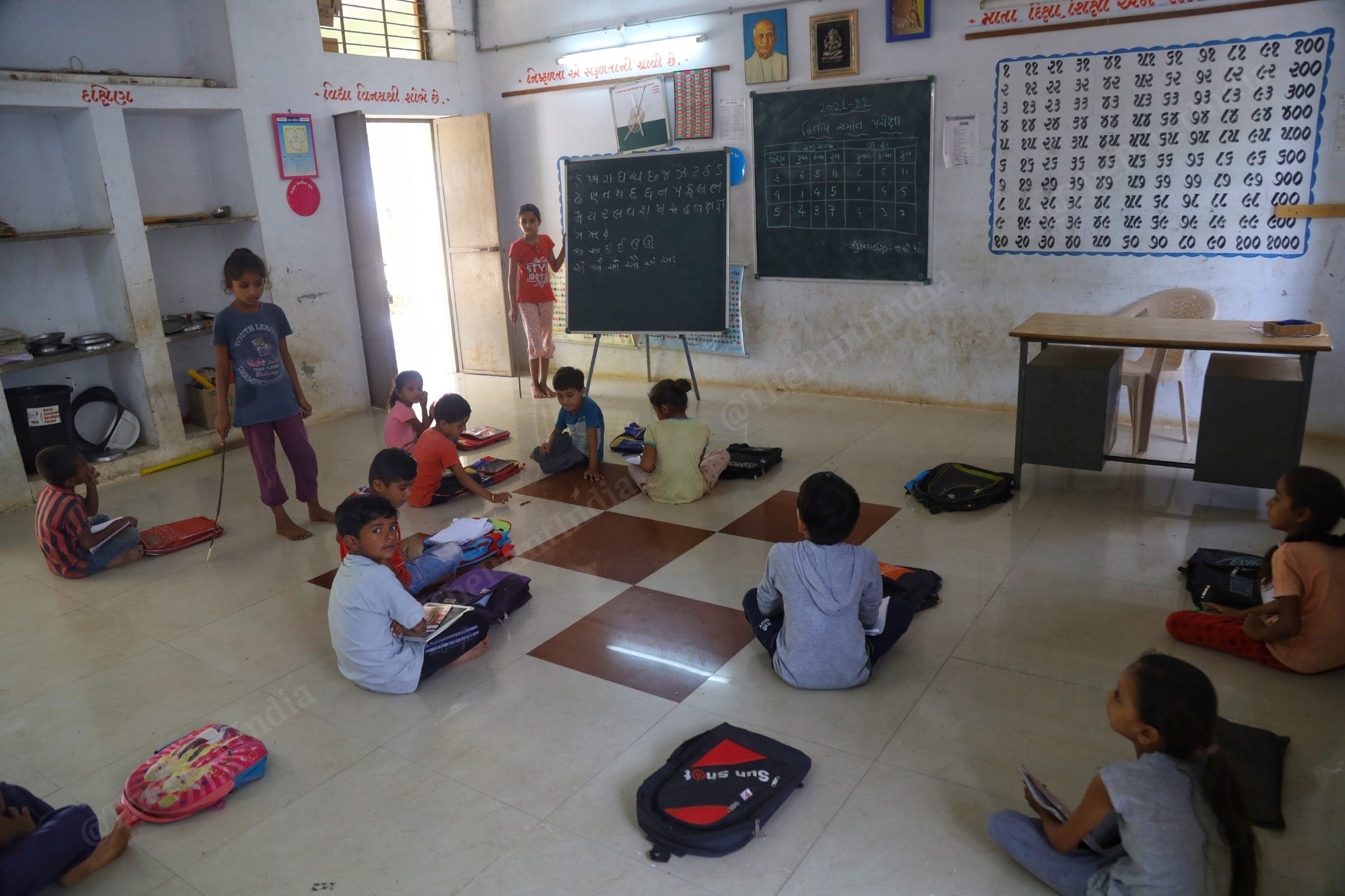 Students of the primary school in Angiya Nana village in Kachchh district wait for their teacher, who is occupied in some administrative work | Manisha Mondal | ThePrint