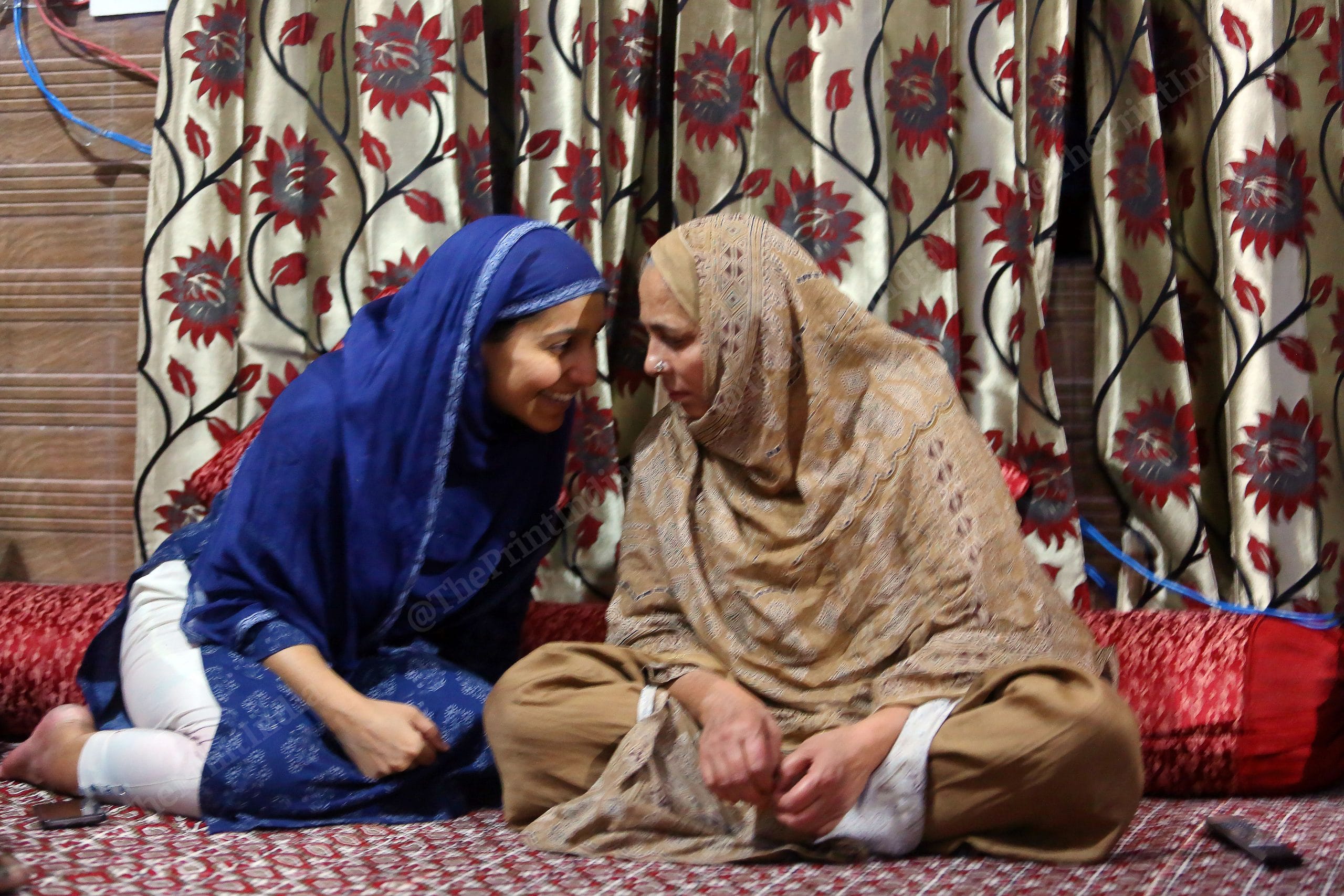 Seema Begam ( Mother) and Shehnaz ( Sister) of Umran Malik talking to each other while watching an IPL match at his home | Photo: Praveen Jain | ThePrint