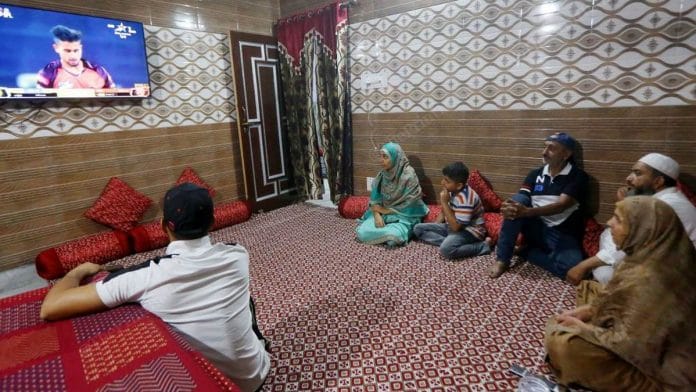 Umran Malik's family and friends watch him play for SunRisers Hyderabad in the Indian Premier League at their family home in Jammu | Photo: Praveen Jain | ThePrint