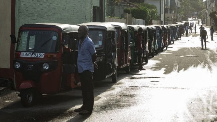 Three-wheelers line up for fuel at a gas station after a nationwide curfew was lifted for a few hours in Colombo, Sri Lanka, on 12 May 2022 | Bloomberg