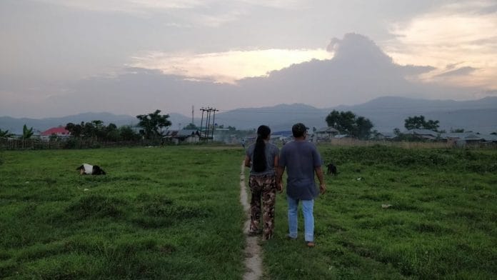 Mary and John walk around the neighborhood in Churachandpur. | Photo Credit: Sonal Matharu