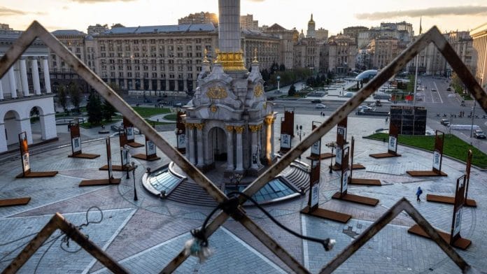 A man walks through a nearly deserted Maidan Square in Kyiv, Ukraine | Photographer: John Moore/Getty Images via Bloomberg