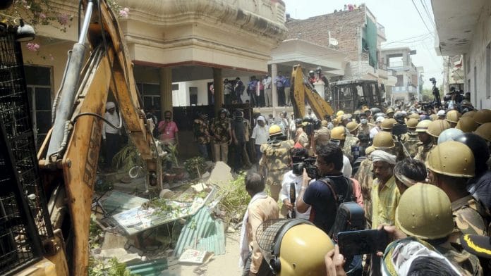 File photo | Bulldozers being used to demolish the residence of Mohammed Javed, Prayagraj | PTI
