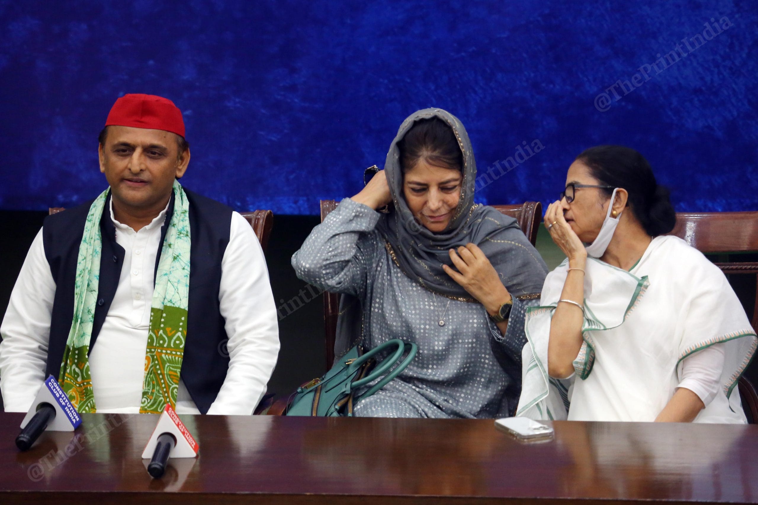 Mehbooba Mufti and Mamata Banerjee in conversation, as Akhilesh Yadav sits by | Praveen Jain | ThePrint