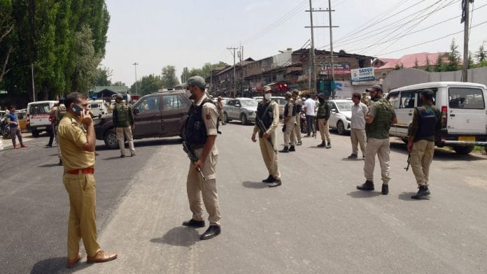 Police personnel stand guard during a protest against the killing of a school teacher in Srinagar's Kulgam, on 31 May 2022 | ANI photo