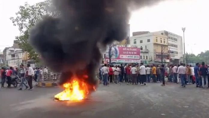 Smoke billows from a burning object after violence erupted in the area following the murder of a tailor named Kanhaiya Lal in Udaipur, on 28 June 2022 | PTI