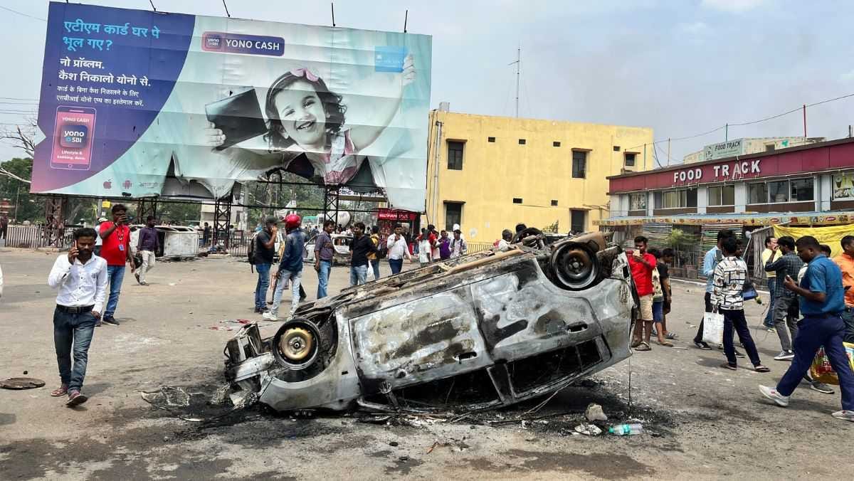 The burnt body of a car on the streets of Danapur, Bihar, amid protests over the Centre’s Agnipath military recruitment scheme, 17 June, 2022 | Jyoti Yadav, ThePrint
