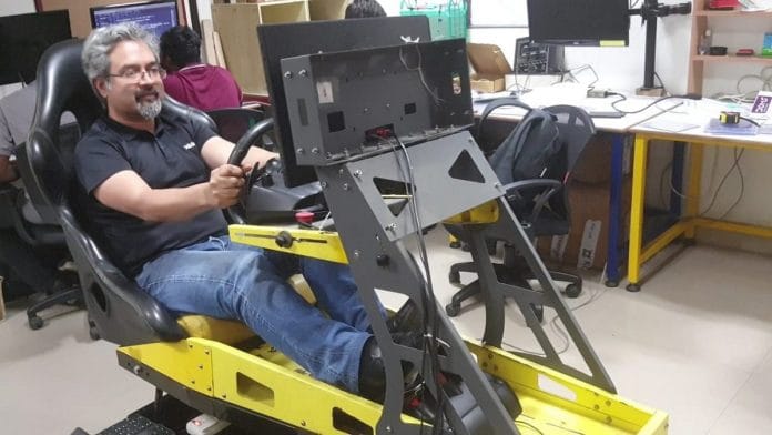 Alok Mohanty of Lazy Idli at IKP EDEN. He is driving a simulated car that he says is 