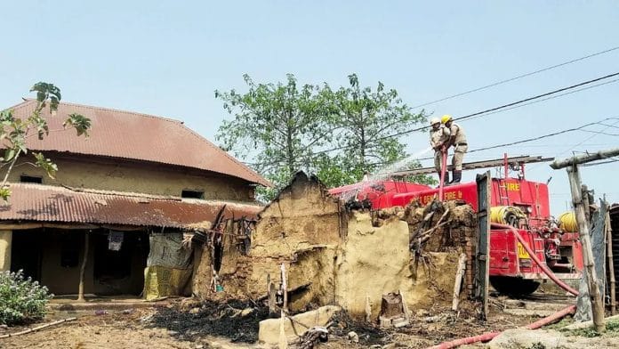 File photo of firemen dousing the fire that charred several houses at Rampurhat in Birbhum on 22 March | ANI