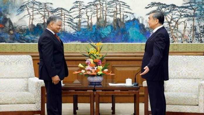 India’s new envoy to Beijing Pradeep Kumar Rawat with Chinese State Councilor and Foreign Minister Wang Yi | Twitter/@JiRongMFA