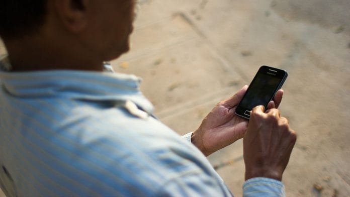 Representational image of a man using a mobile phone | Victorgrigas/Commons (CC BY-SA 3.0)
