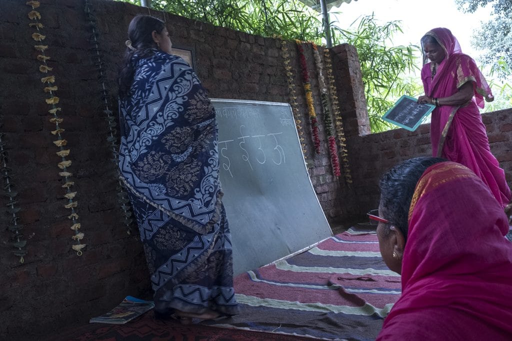 A student shows the teacher if she has been able to write correctly | Jayati Saha