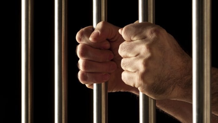 Representational photo of a prisoner behind bars | Pxfuel