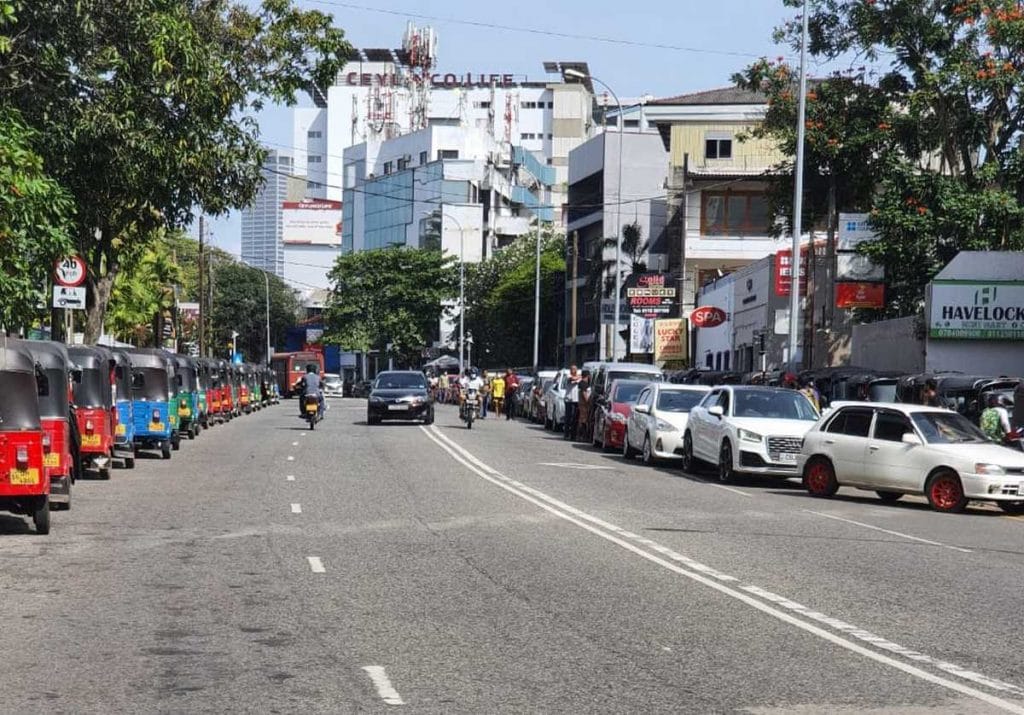 A long line of autos and cars waiting for fuel. There are hardly any vehicles to be seen actually travelling on the roads | Regina Mihindukulasuriya | ThePrint